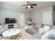 Bonus room with sectional sofa, hanging chair, and TV at 401 Streamwood Dr, Holly Springs, NC 27540
