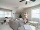 Bonus room with sectional sofa, workspace, and window seating at 401 Streamwood Dr, Holly Springs, NC 27540