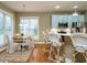 Charming breakfast nook with a round table and wicker chairs at 401 Streamwood Dr, Holly Springs, NC 27540