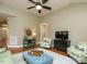 Living room with hardwood floors and comfortable seating at 401 Streamwood Dr, Holly Springs, NC 27540