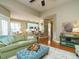 Open living room with a view into the kitchen and breakfast nook at 401 Streamwood Dr, Holly Springs, NC 27540