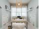 Home office with wood desk, window light, and built-in shelves at 401 Streamwood Dr, Holly Springs, NC 27540