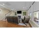 Gathering room with fireplace, built-ins and leather furniture at 4033 Periwinkle Blue Ln, Raleigh, NC 27612