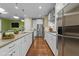 Spacious kitchen featuring stainless steel appliances and granite countertops at 4033 Periwinkle Blue Ln, Raleigh, NC 27612