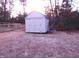 View of a backyard with a storage shed and swing set at 409 James Toney Dr, Elon, NC 27244