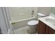 Bathroom with tub, toilet and wood vanity at 409 James Toney Dr, Elon, NC 27244
