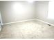 Simple carpeted bedroom with neutral walls and window at 409 James Toney Dr, Elon, NC 27244