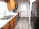Kitchen with stainless steel appliances and light wood cabinets at 409 James Toney Dr, Elon, NC 27244