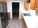 Kitchen with stainless steel appliances and light wood cabinets at 409 James Toney Dr, Elon, NC 27244