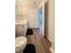 Bathroom with double vanity, toilet and access to bedroom at 4232 Vienna Crest Dr, Raleigh, NC 27613