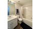 Clean bathroom with white vanity, tub, and shower at 4232 Vienna Crest Dr, Raleigh, NC 27613