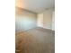 Spacious bedroom with carpeted floor, neutral walls, and an interior door at 4232 Vienna Crest Dr, Raleigh, NC 27613