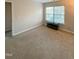 Spacious bedroom with carpeted floor, large window, and a media console at 4232 Vienna Crest Dr, Raleigh, NC 27613