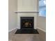 Elegant fireplace with white mantel and dark hearth at 4232 Vienna Crest Dr, Raleigh, NC 27613