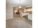 Bright kitchen with white cabinets, stainless steel appliances, and an island at 4232 Vienna Crest Dr, Raleigh, NC 27613