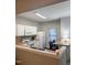 Efficient kitchen featuring white cabinets, a breakfast bar, and a window at 4232 Vienna Crest Dr, Raleigh, NC 27613