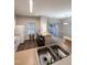 Galley kitchen with double sink, white cabinets and breakfast bar at 4232 Vienna Crest Dr, Raleigh, NC 27613