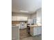 Well-equipped kitchen with white cabinets and a breakfast bar at 4232 Vienna Crest Dr, Raleigh, NC 27613