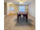 Open living room featuring a dining area and double doors at 4232 Vienna Crest Dr, Raleigh, NC 27613