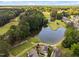 Aerial view of golf course community with lake features stunning home and neighborhood views at 5101 Hogans Way, Clayton, NC 27520