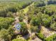 Aerial view of neighborhood near golf course and lake showing proximity and community location at 5101 Hogans Way, Clayton, NC 27520