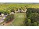 Expansive aerial view of golf course homes surrounded by lush greenery at 5101 Hogans Way, Clayton, NC 27520