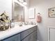 Charming bathroom featuring a grey vanity with a bright white countertop and modern fixtures at 5101 Hogans Way, Clayton, NC 27520