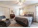 Cozy bedroom featuring a comfortable bed, a reading nook, and ample closet space for storage at 5101 Hogans Way, Clayton, NC 27520