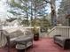 Wooden deck with wicker furniture, offering a relaxing outdoor space at 5101 Hogans Way, Clayton, NC 27520