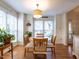 Charming dining area with wood floors and a round table for four at 5101 Hogans Way, Clayton, NC 27520