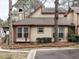 Rear view of tan house with red trim, and mature trees at 5101 Hogans Way, Clayton, NC 27520