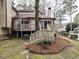 Back exterior showcasing a deck and stairs leading to the yard at 5101 Hogans Way, Clayton, NC 27520