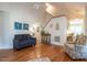 Living room with hardwood floors and access to sunroom at 5101 Hogans Way, Clayton, NC 27520