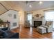 Living room with hardwood floors, fireplace, and ample natural light at 5101 Hogans Way, Clayton, NC 27520