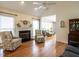 Living room featuring hardwood floors, fireplace, and comfy seating at 5101 Hogans Way, Clayton, NC 27520