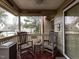 Relaxing covered porch with rocking chairs, perfect for enjoying the neighborhood view at 5101 Hogans Way, Clayton, NC 27520