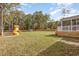 Large backyard with a playset, fenced perimeter, and view of the home's deck, ideal for Gathering fun at 539 Long Grass Dr, Smithfield, NC 27577