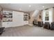 Versatile basement area with built-in shelves and a desk is perfect for a playroom or home office at 539 Long Grass Dr, Smithfield, NC 27577