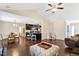 Open living area with hardwood floors, kitchen island, and a cozy seating area at 58 London Ln, Angier, NC 27501