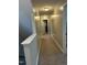 Long hallway with carpet and lighting at 70 Maxwell Pl, Lillington, NC 27546