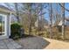 Backyard with a patio, grill, and tree coverage at 701 Brickstone Dr, Apex, NC 27502
