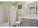 Bathroom features a tub and shower with neutral colored shower curtain at 701 Brickstone Dr, Apex, NC 27502