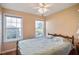 Cozy bedroom with two bright windows that provide plenty of natural light and nice outside views at 701 Brickstone Dr, Apex, NC 27502