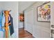 Entryway with hardwood floors, coat rack, white molding, and a closet at 701 Brickstone Dr, Apex, NC 27502