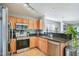 View of kitchen featuring stainless steel appliances and granite countertops at 701 Brickstone Dr, Apex, NC 27502