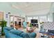 Spacious living room with fireplace and large windows creating a light filled space at 701 Brickstone Dr, Apex, NC 27502