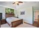 Inviting primary bedroom features a ceiling fan, stylish decor, and two windows for natural light at 701 Brickstone Dr, Apex, NC 27502