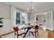 Elegant dining room with glass table and wood chairs at 709 S Boylan Ave, Raleigh, NC 27603