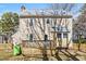 Tan house exterior with a deck and backyard at 7120 Sandringham Dr, Raleigh, NC 27613