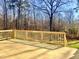 Wooden back deck with a wood railing overlooking the yard and wooded area at 727 Cook Rd, Durham, NC 27713